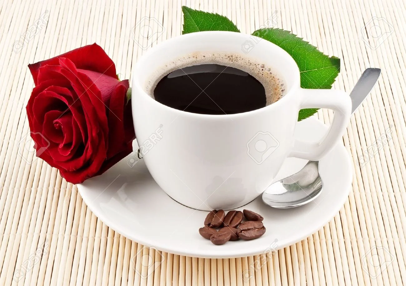 10359748-Cup-of-coffee-and-red-rose-on-textured-background-Stock-Photo-single.webp