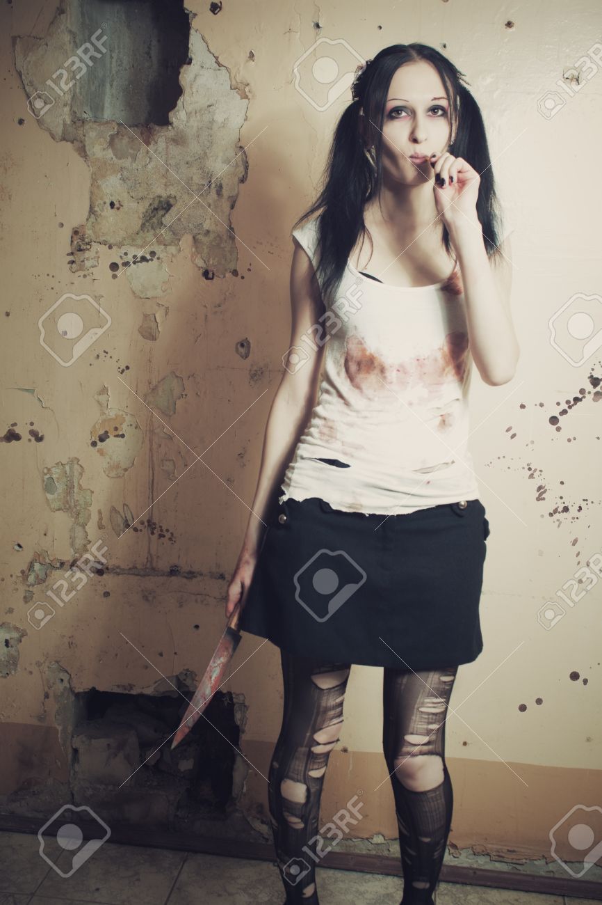 16517139-Pretty-cute-gothic-girl-with-bloody-knife-and-lollipop-Stock-Photo.jpg