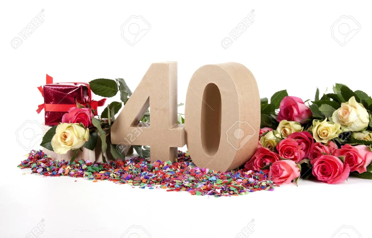 16843802-number-of-age-in-a-colorful-studio-setting-with-fresh-roses-on-a-bottom-of-confetti.webp