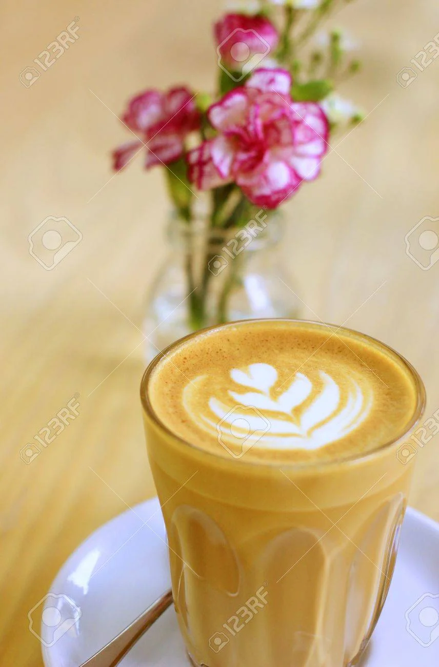 20681412-cup-of-art-latte-or-cappuccino-coffee-with-flower.webp