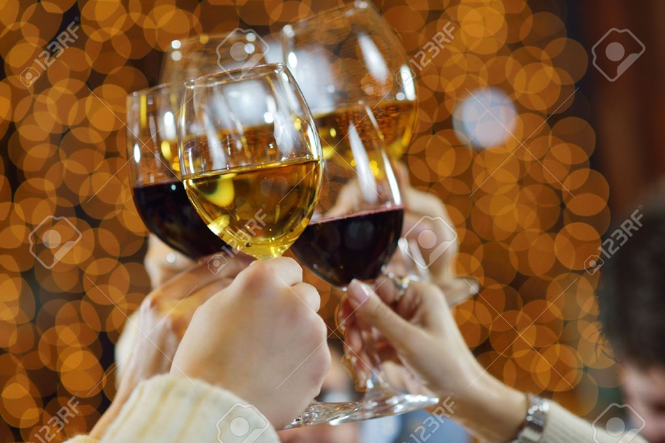 21285219-Celebration-Hands-holding-the-glasses-of-champagne-and-wine--Stock-Photo.jpg