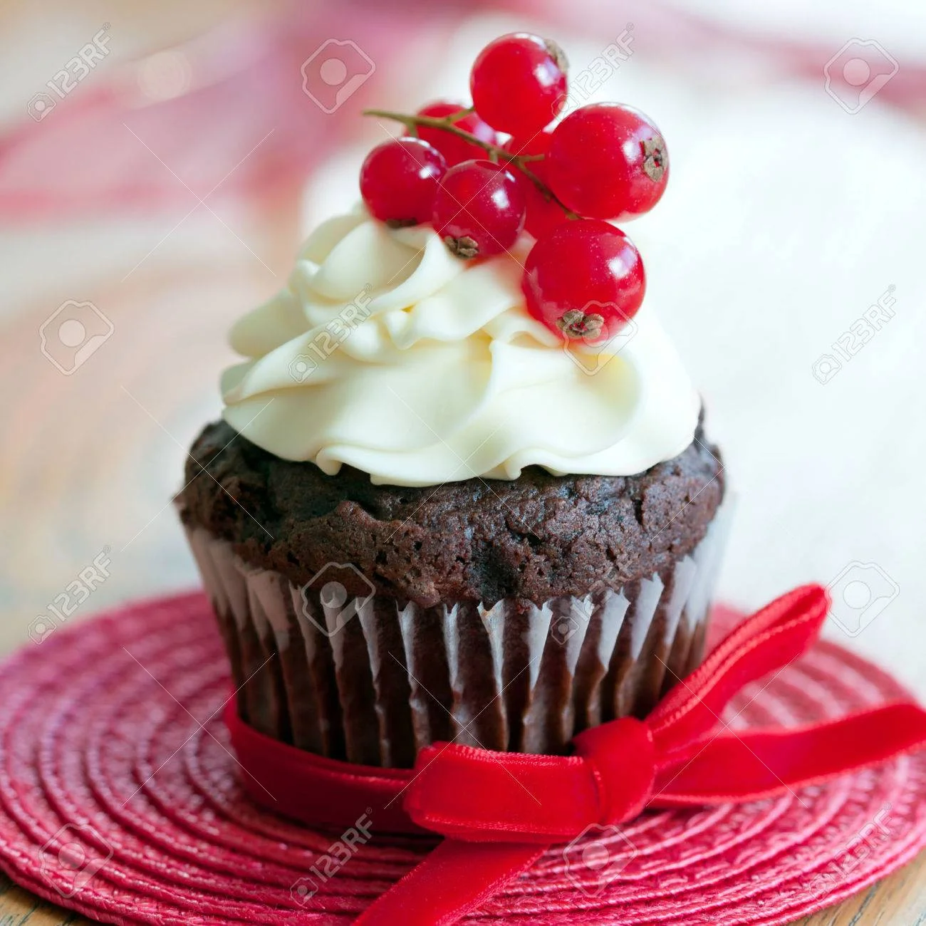 23749910-red-berry-cupcake.webp