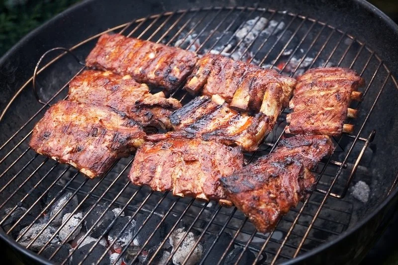 2556203-178485-grilled-pork-ribs-on-bbq-grill-shallow-dof.webp