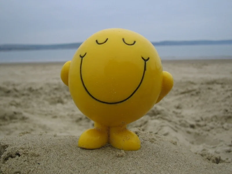 28-smiley-face-on-beach.webp