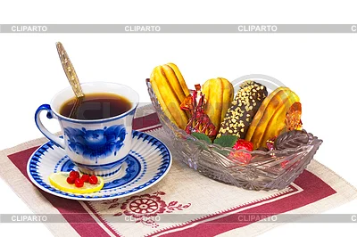 4129817-cup-of-tea-candies-and-cakes-in-wicker-basket.webp