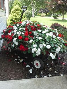 55fa8d2a583ed117529f41330df36500--landscaping-rocks-little-red-wagon-planter.jpg