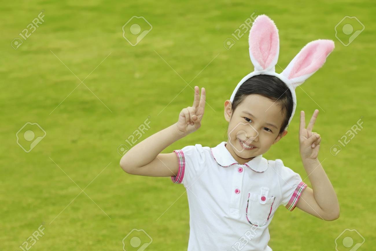 85736000-girl-wearing-bunny-headband-showing-peace-sign.jpg