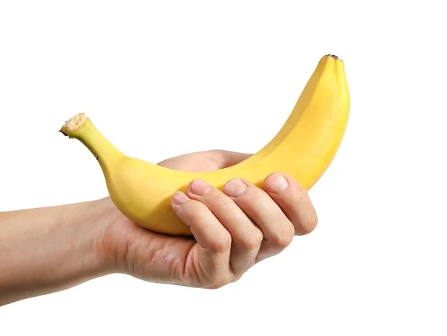 banana-in-hand-on-white-background_342379-1102.webp