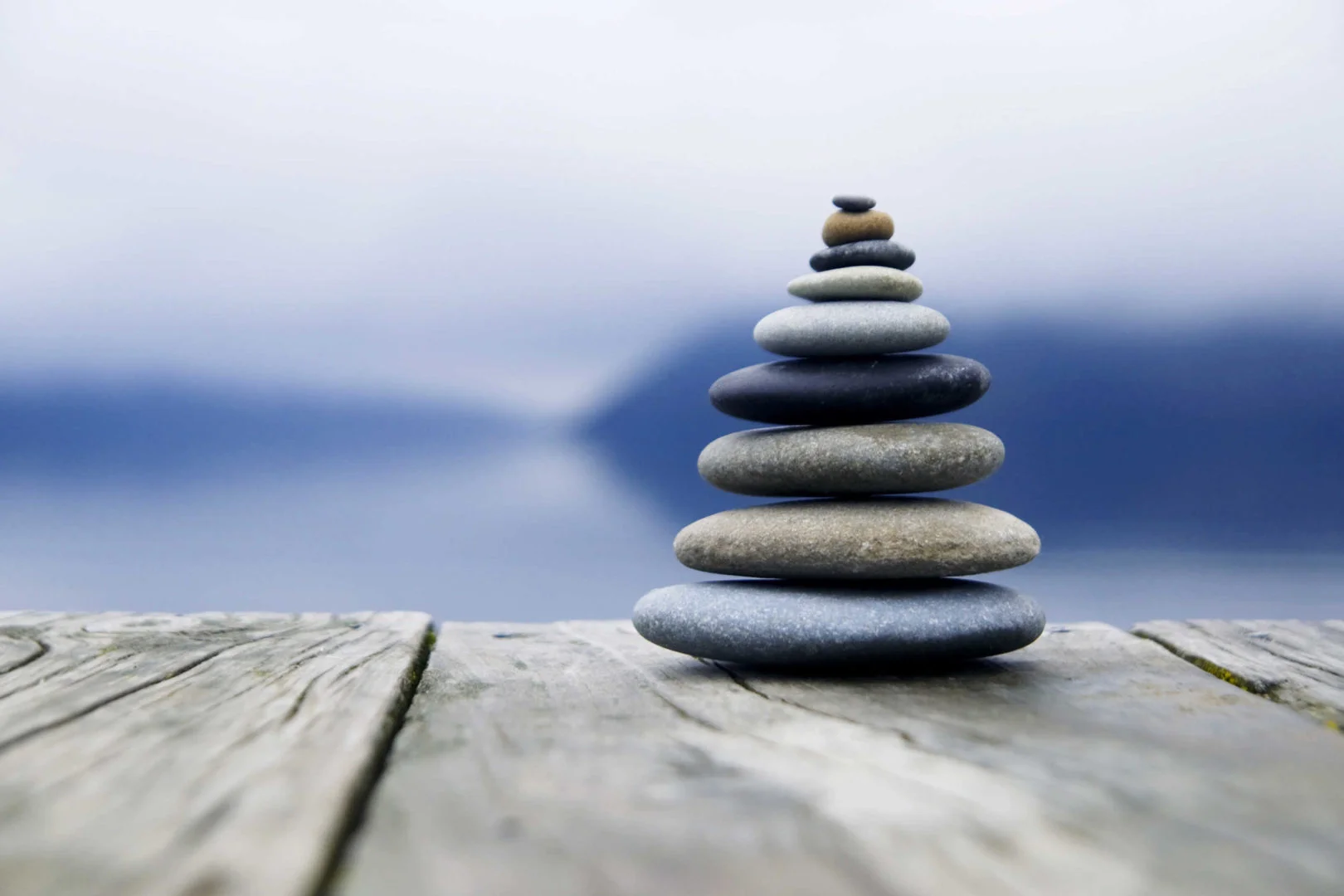 bigstock-zen-balancing-rocks-o-a-deck-62233055-scaled.webp