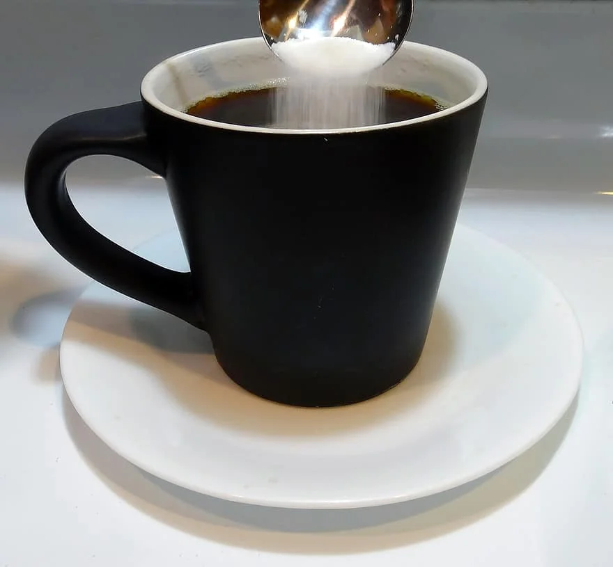 black-coffee-cup-coffee-sugar-and-spoon-saucer-hot-coffee.webp