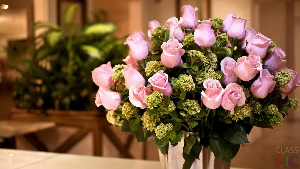 bouquet-of-pink-roses-and-grenery.webp