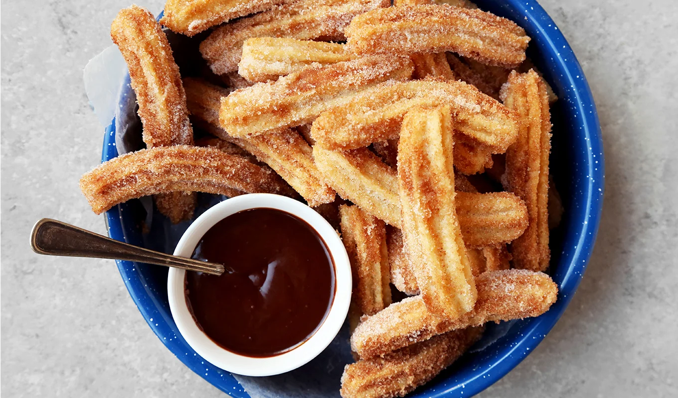 Churros-with-chocolate-sauce.webp