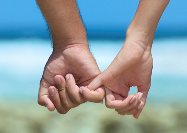 couples-holding-hands-at-beach.png