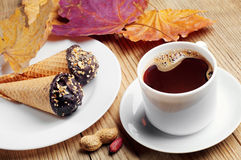 cup-hot-coffee-cakes-maple-autumn-leaves-30595090.jpg