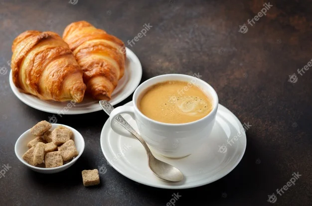 cup-of-fresh-coffee-with-croissants_73387-856.webp