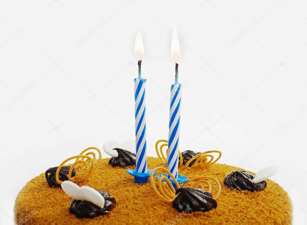 depositphotos_10098923-stock-photo-cake-with-two-candles.webp