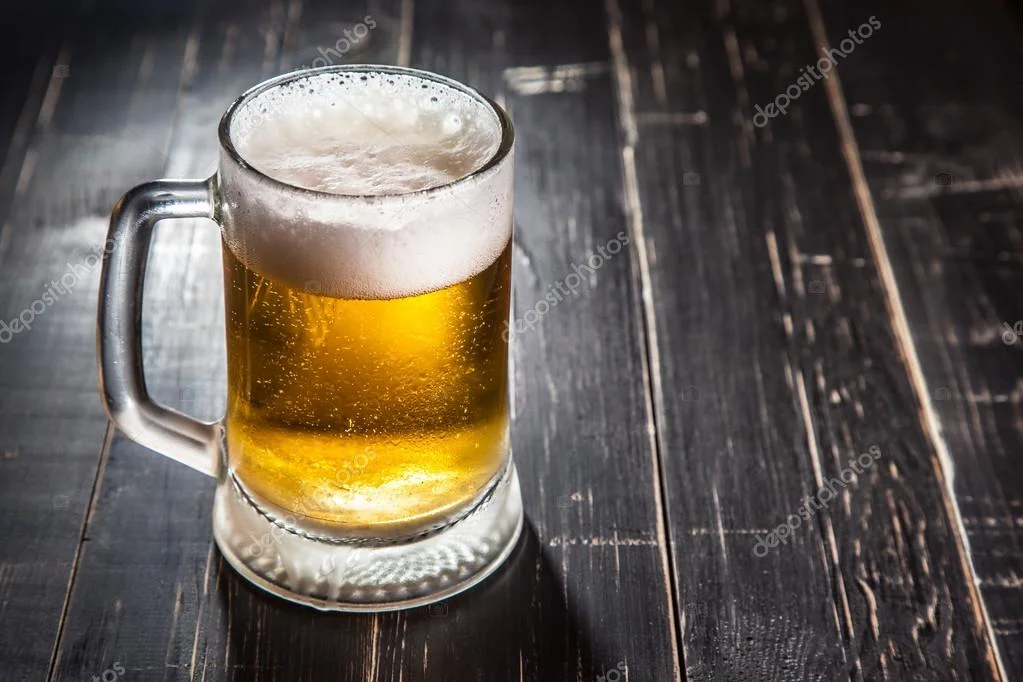 depositphotos_104811304-stock-photo-mug-of-beer-on-table.webp