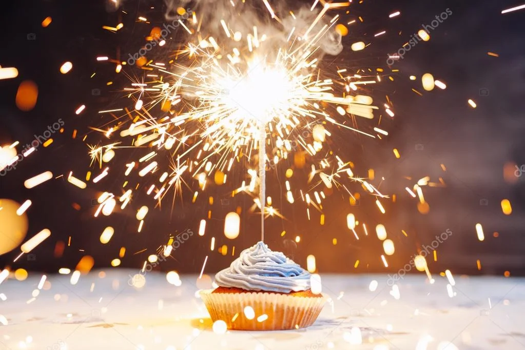 depositphotos_105012382-stock-photo-birthday-cupcake-with-a-sparkler.webp