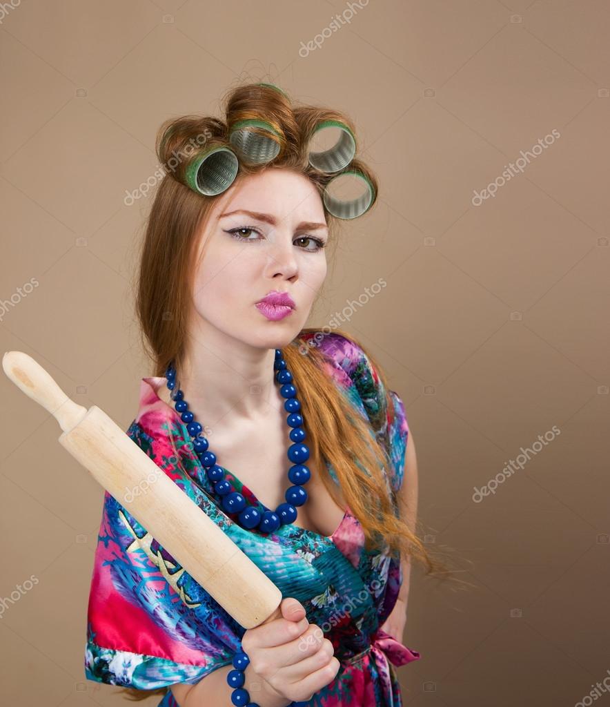 depositphotos_113758884-stock-photo-woman-housewife-with-a-rolling.jpg