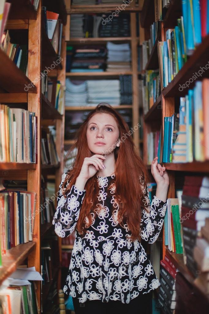 depositphotos_121977756-stock-photo-young-redhead-girl-in-library.jpg