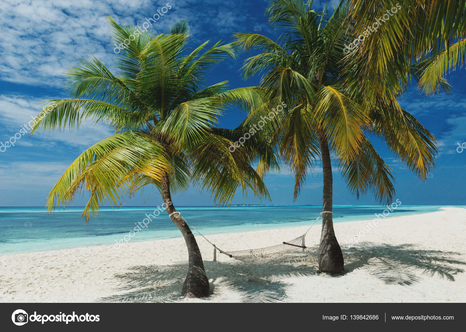 depositphotos_139842686-stock-photo-beach-hammock-on-the-maldives.webp