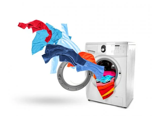 depositphotos_148803069-stock-photo-washing-machine-and-flying-clothes.webp