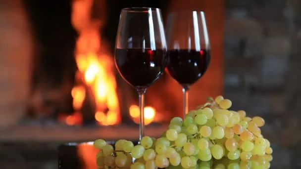 depositphotos_171486284-stock-video-two-glasses-of-red-wine (1).webp