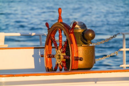 depositphotos_17440977-stock-photo-antique-boat-steering-wheel-compass.jpg