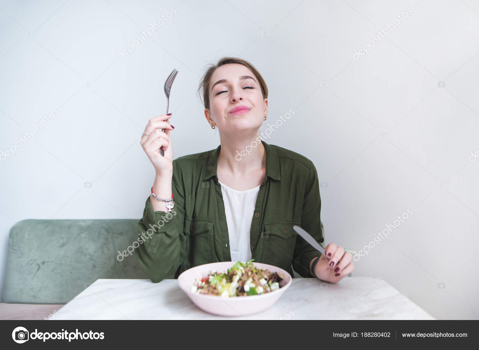 depositphotos_188280402-stock-photo-the-woman-eats-a-delicious.jpg