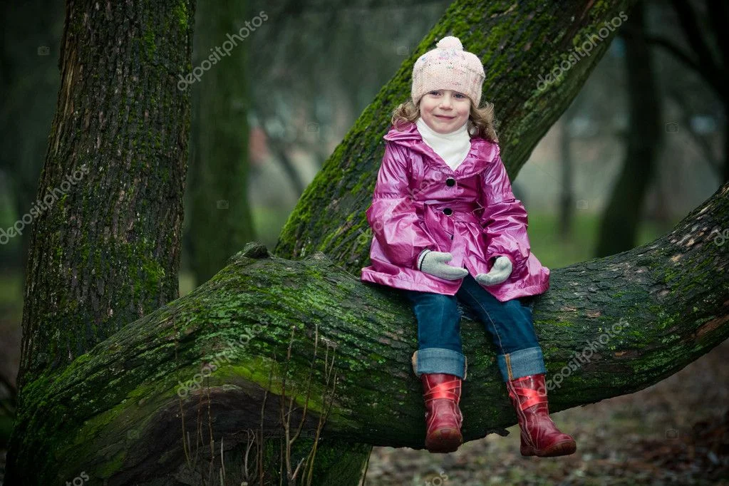 depositphotos_1889707-stock-photo-girl-sits-on-a-tree.webp