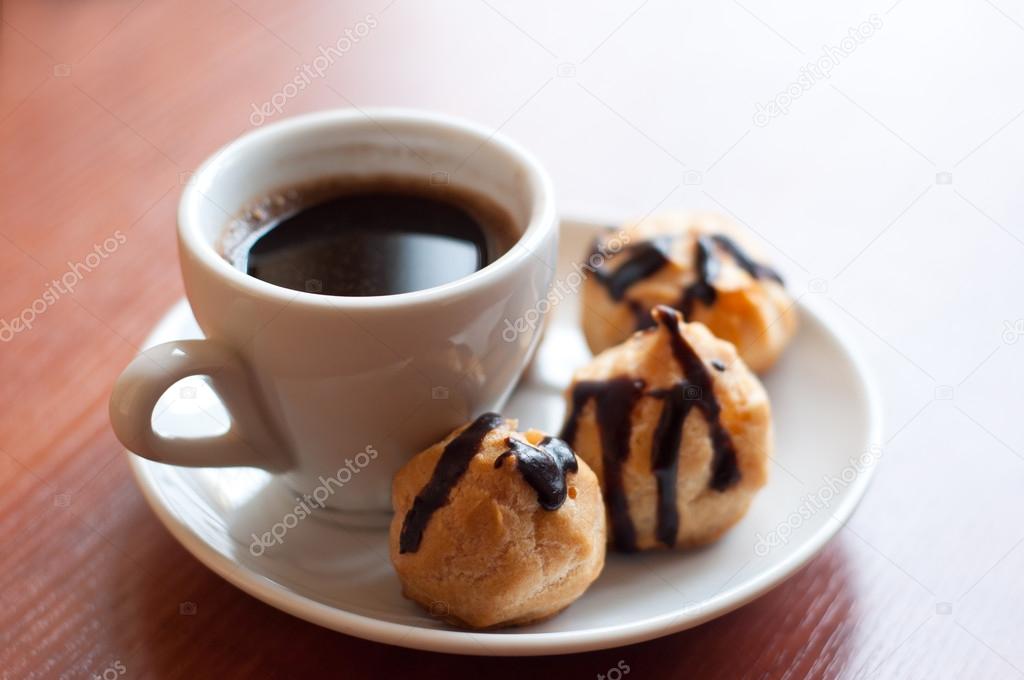 depositphotos_22119779-stock-photo-eclairs-with-coffee.jpg