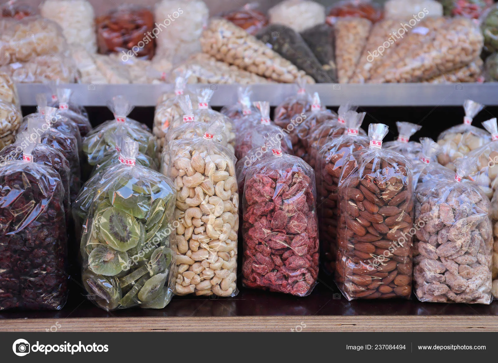 depositphotos_237084494-stock-photo-dried-fruit-nuts-bags-sale.webp