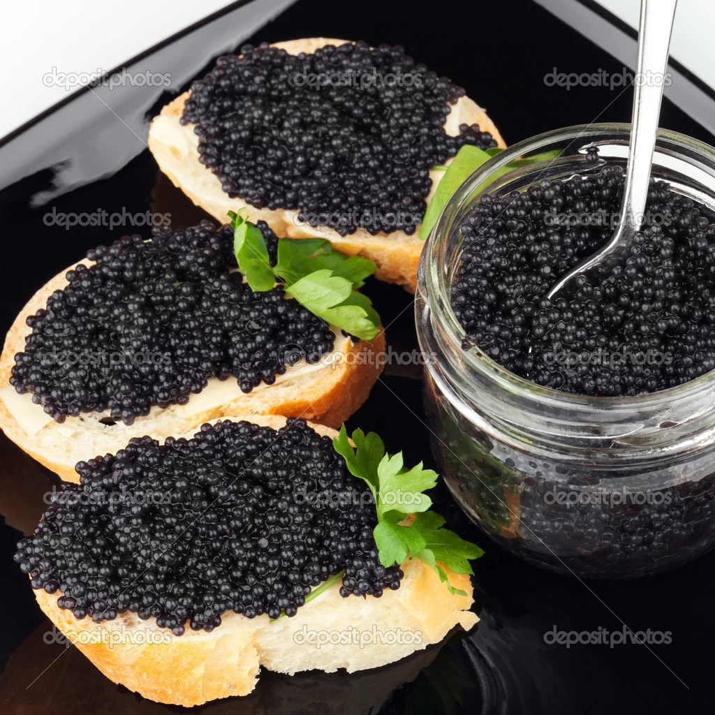 depositphotos_36457211-Sandwiches-with-black-caviar-on-dark-plate.webp