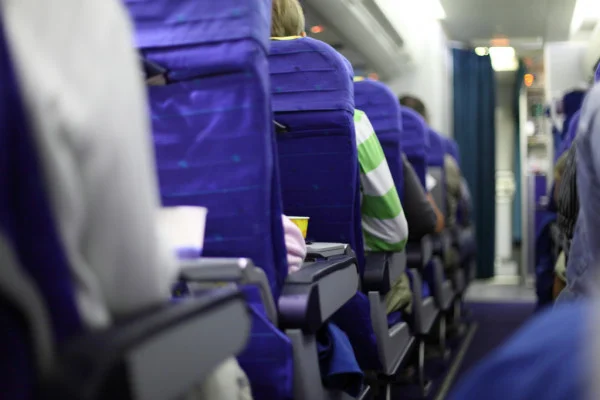 depositphotos_5867997-stock-photo-airplane-seats-in-row.webp