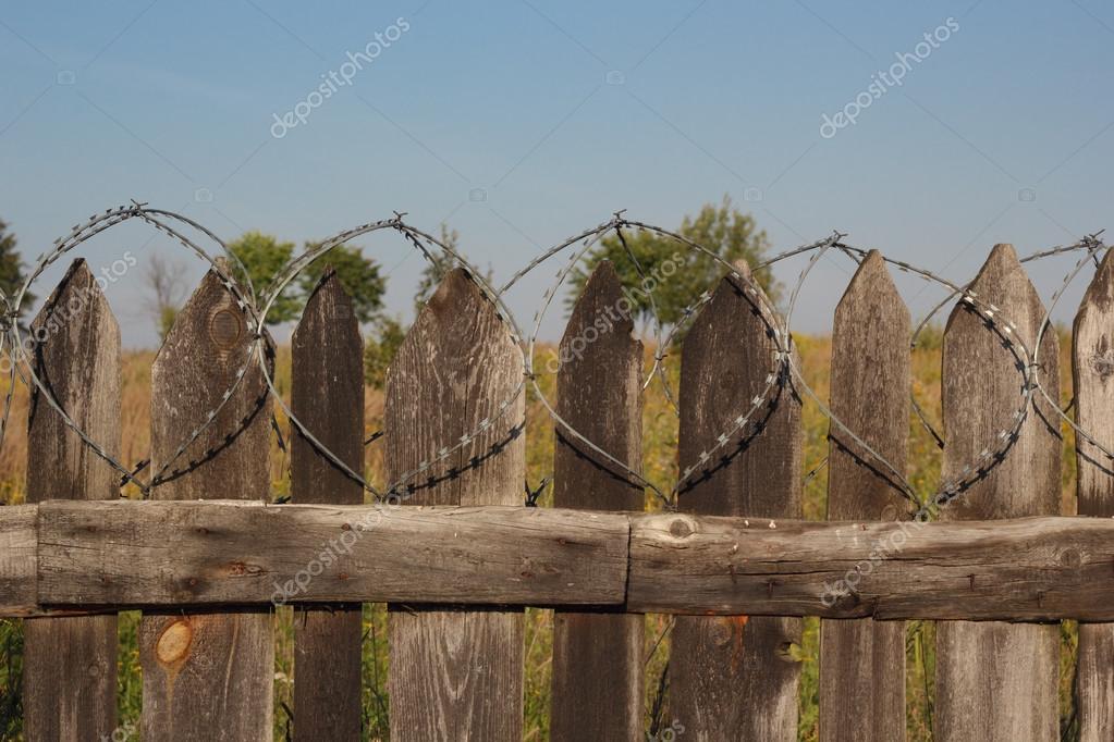 depositphotos_83428388-stock-photo-old-wooden-fence-with-barbed.jpg