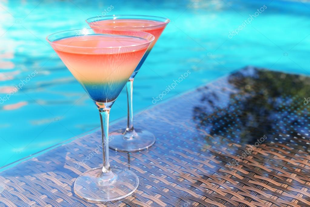 depositphotos_86125710-stock-photo-cocktails-on-swimming-pool-background.jpg