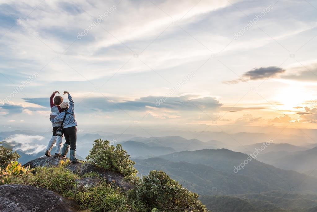 depositphotos_90130270-stock-photo-young-happy-tourist-on-top.jpg