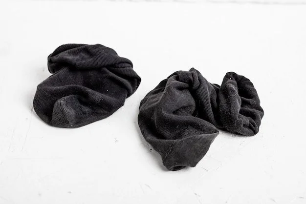 dirty-old-socks-white-background-wrinkled-worn-men-s-black-socks_209484-10691.webp