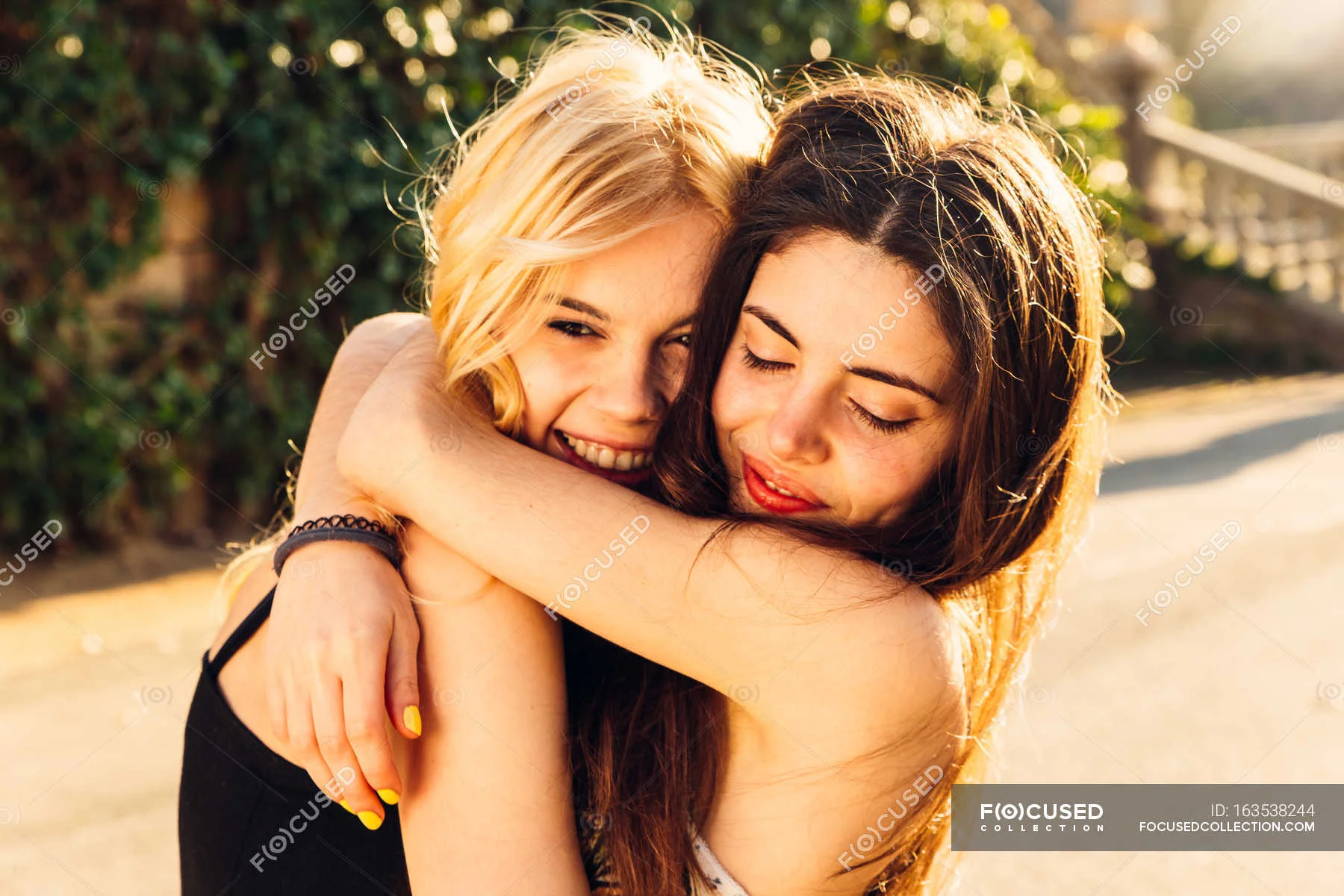 focused_163538244-stock-photo-two-girls-hugging.webp