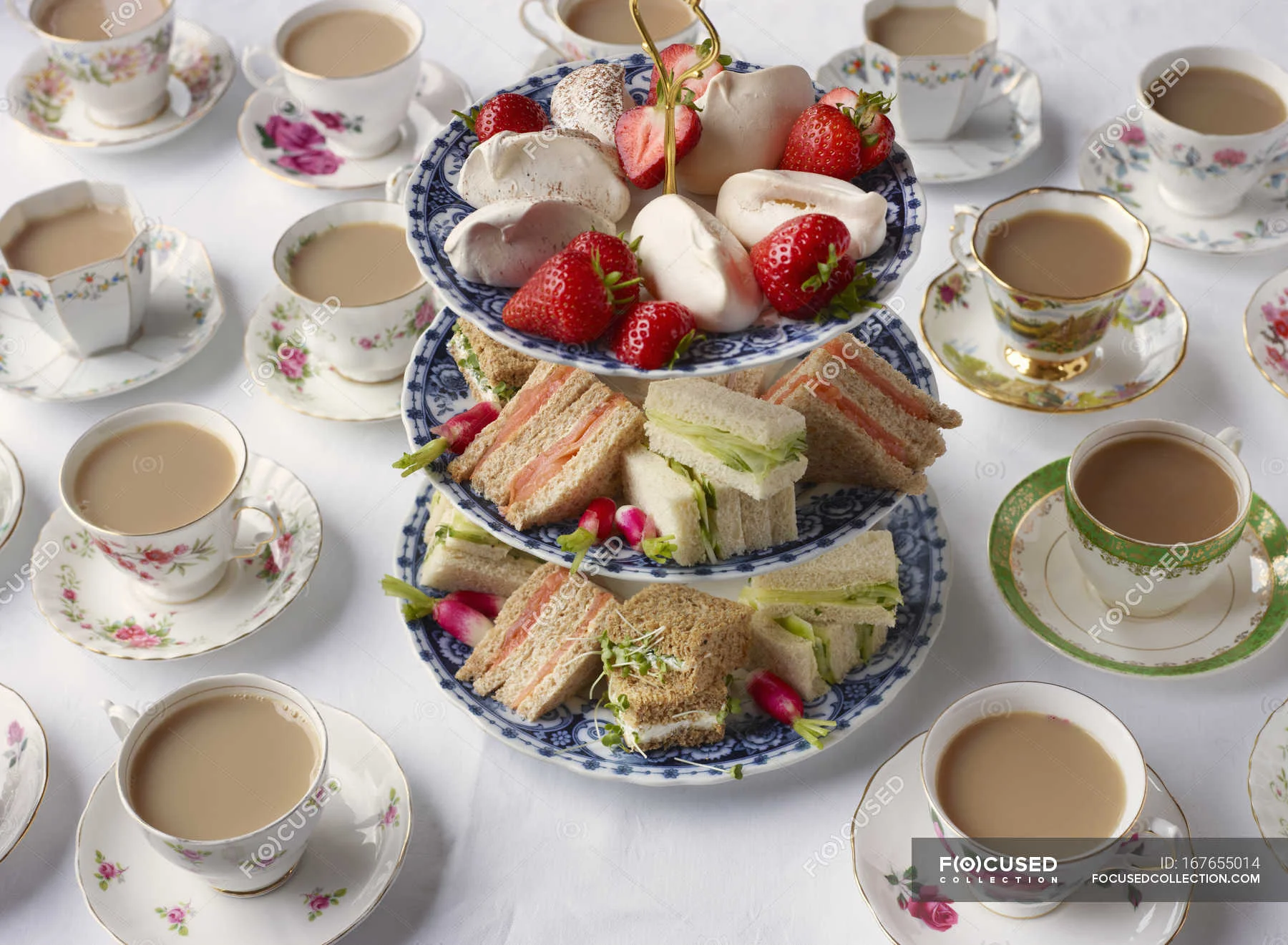 focused_167655014-stock-photo-vintage-tea-cups-sandwiches-cakestand.webp
