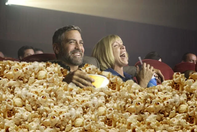 George-Clooney-Eating-Popcorn-at-Movies-64616.webp