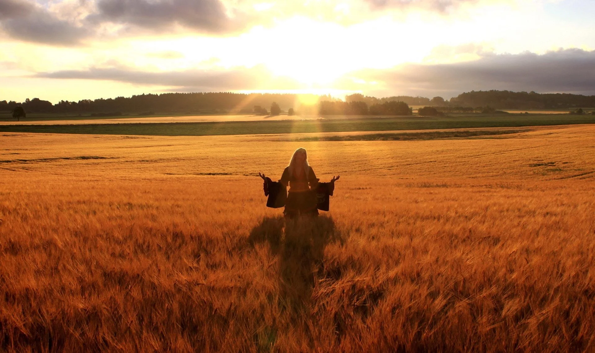 happy-woman-in-golden-wheat-field.webp