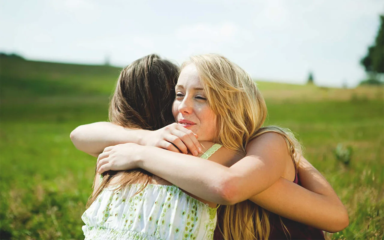 hug-friend-social-support-Image-Source-56a905b43df78cf772a2e684.webp
