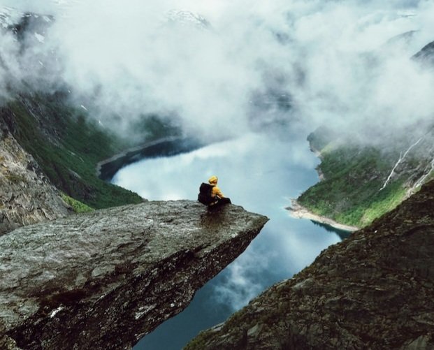 man-sits-end-trolltunga-before-mountains_1304-5318.jpg