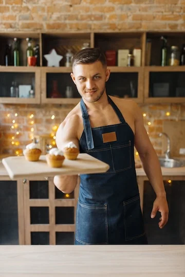 nude-husband-apron-holds-tray-with-sweet-dessert-kitchen-naked-male-person-preparing-breakfas...webp