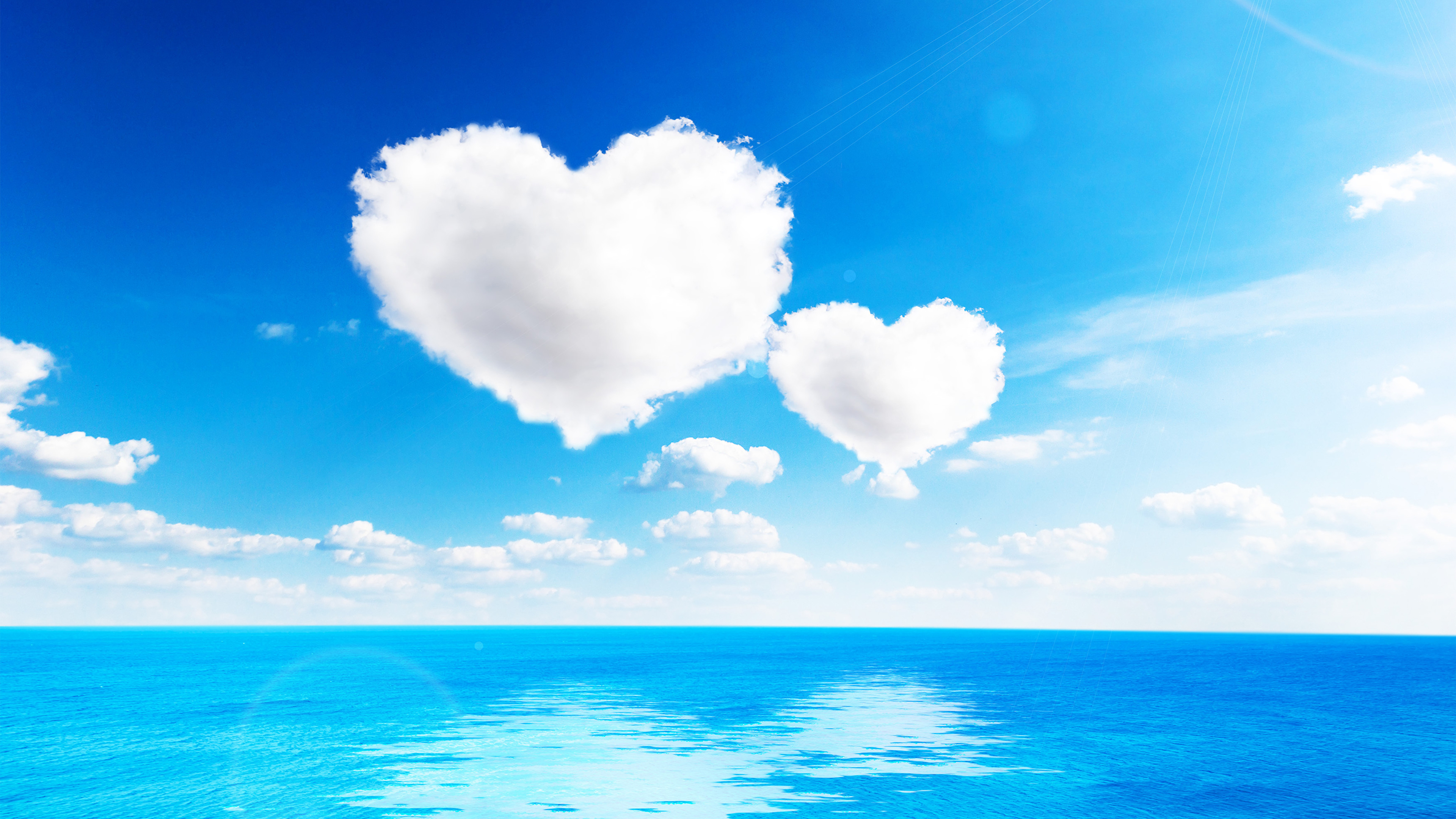 Sea_Sky_Clouds_Heart_Horizon_512808_3840x2160.jpg