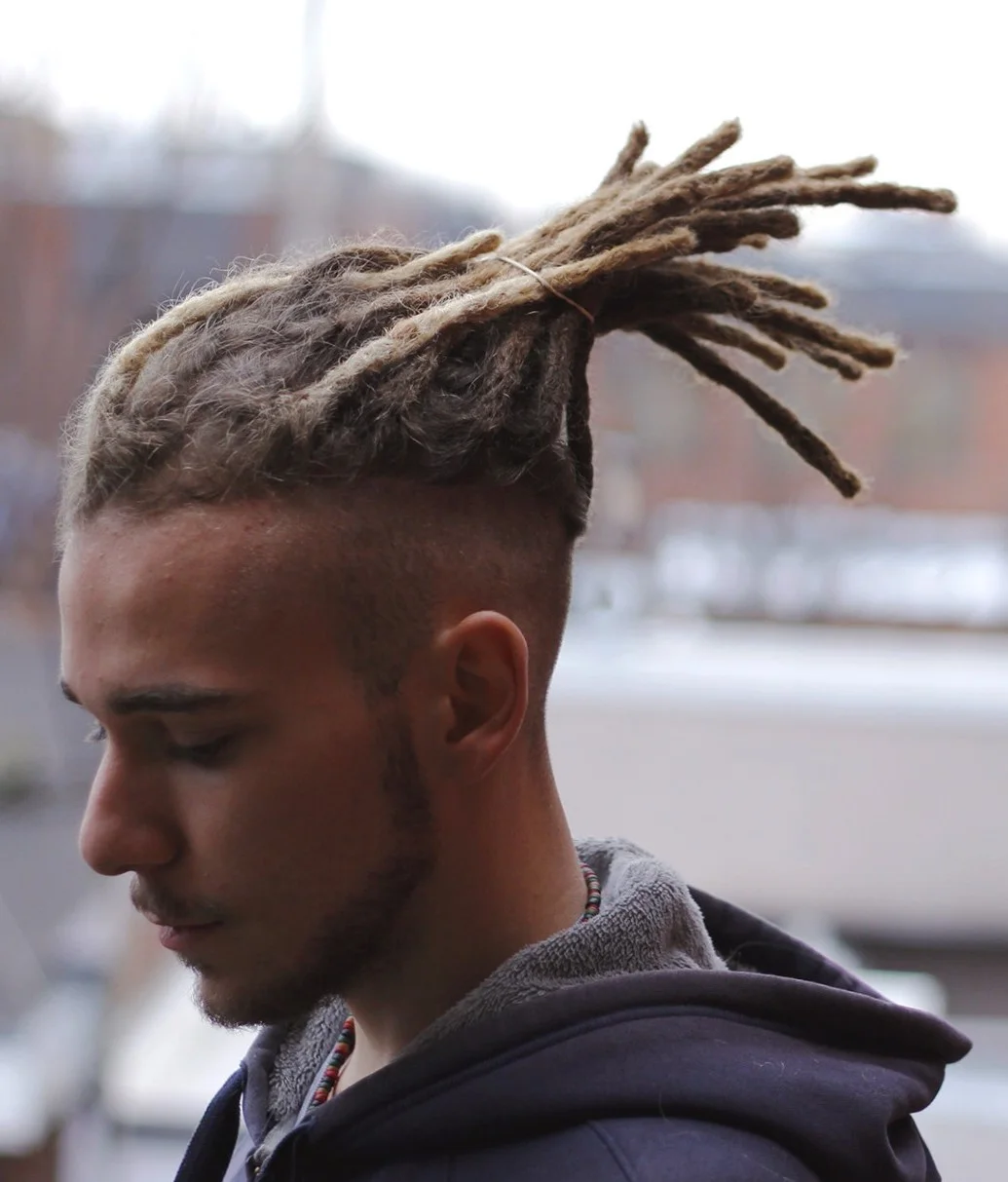 white-dude-dread-guy-shaved-sides.webp