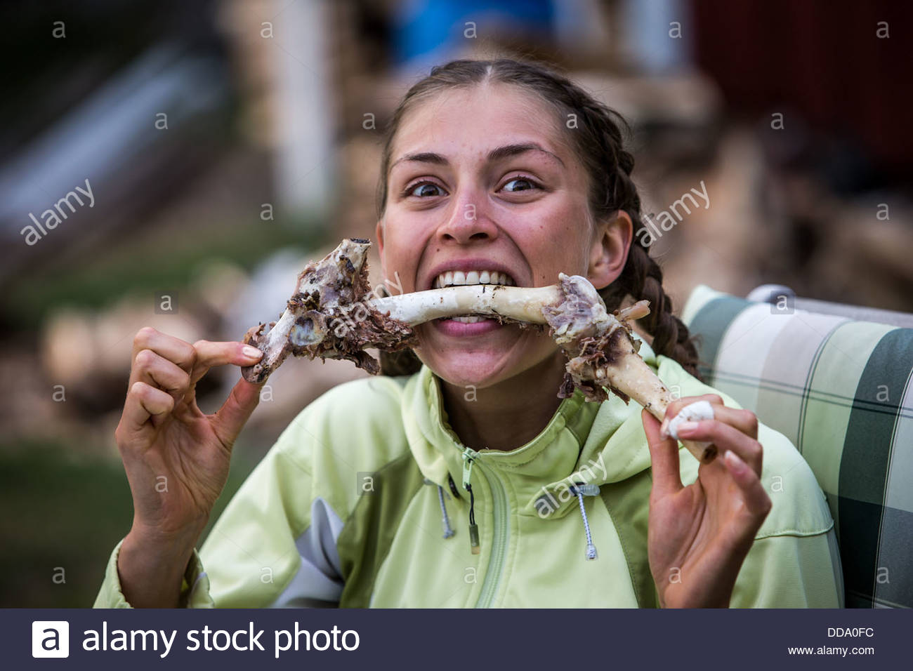 woman-eating-meat-off-a-bone-DDA0FC.jpg