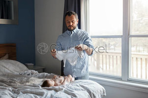 stock-photo-middle-age-caucasian-father-changing-diaper-clothes-for-newborn-baby-daughter-son-...jpg