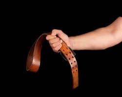 brown-leather-belt-with-an-iron-buckle-in-a-man-s-hand_116441-5200.jpg